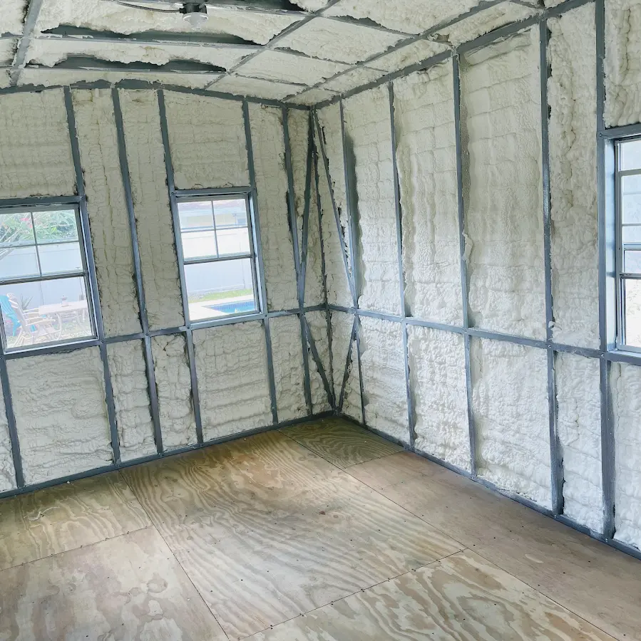 Closed-cell spray foam insulation applied to wall cavities in a residential project in Sioux Center